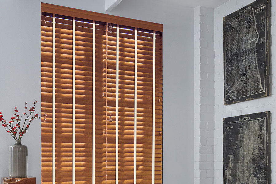 Light faux wood blinds in a corner of a kitchen